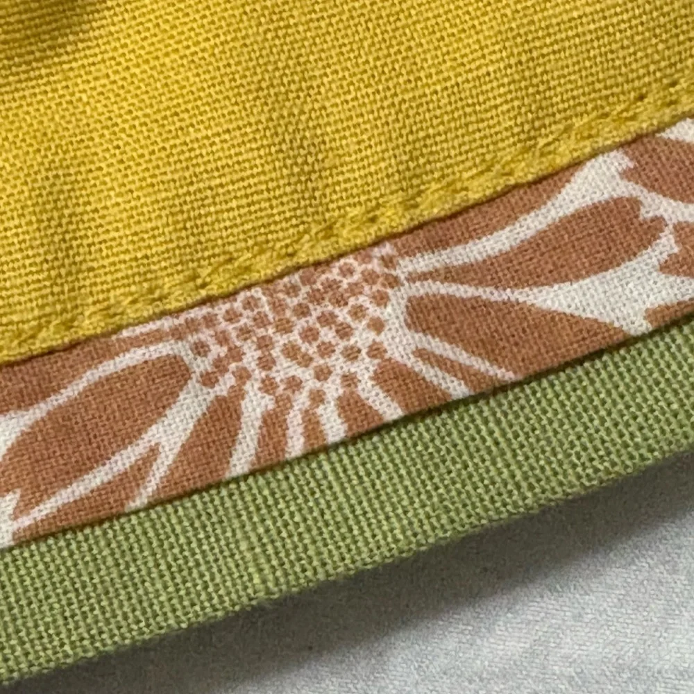 Cute bunny table runner by Pier 1 Imports. Golden yellow with cream bunnies.